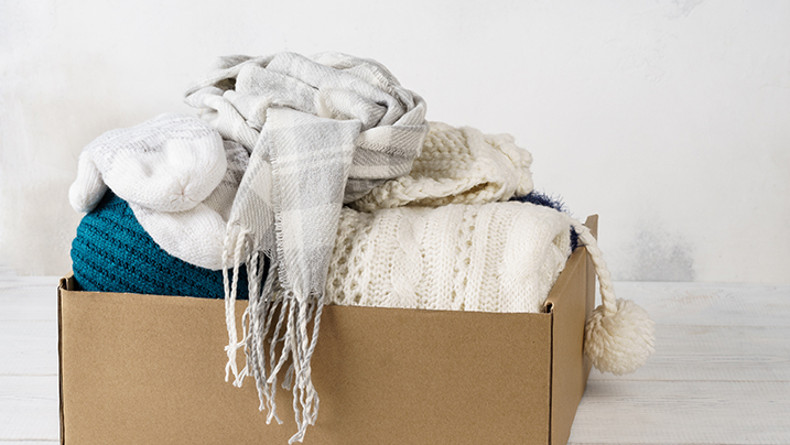 Winter,Clothes,In,A,Cardboard,Box.,Seasonal,Clothing,For,Shipping