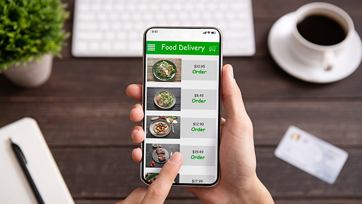 Food,Delivery.,Businessman,Choosing,Meal,For,Lunch,In,Takeaway,Restaurant