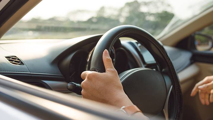 Male,Hands,On,Steering,Wheel,On,The,Right,With,Country