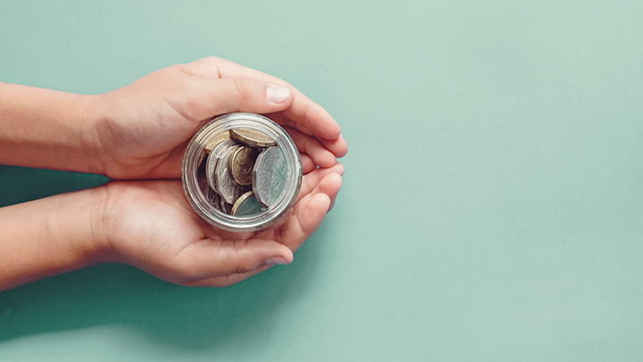 Hands,Holding,Money,Jar,,Donation,,Saving,,Charity,,Family,Finance,Plan